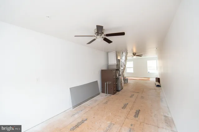wooden floor in an empty room and a window