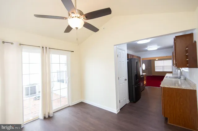 a view of living room with furniture and wooden floor