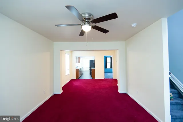a view of livingroom with a ceiling fan and a window