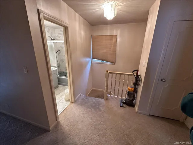 a bedroom with a bed wooden floor and windows