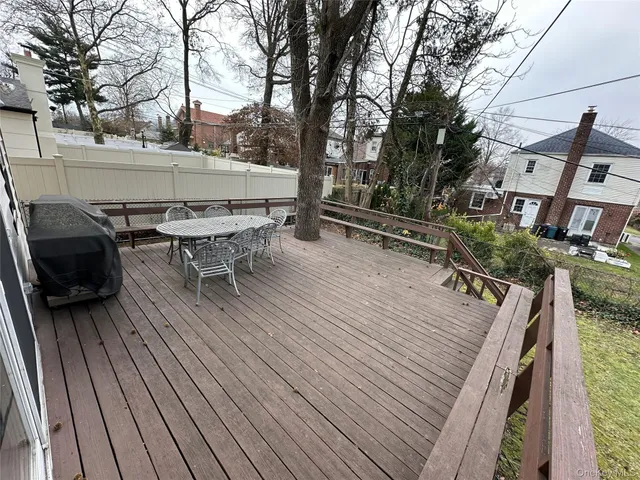 a view of outdoor sitting area with furniture and wooden deck