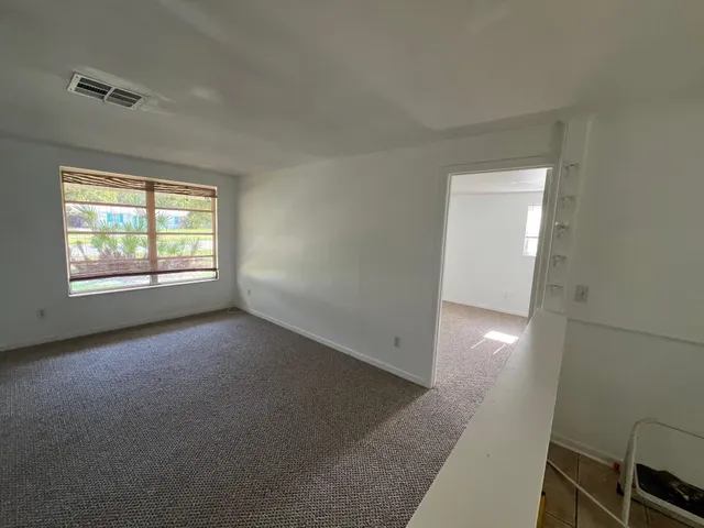 an empty room with windows