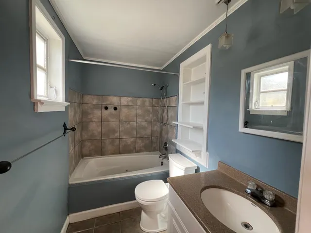 a bathroom with a sink toilet and bathtub