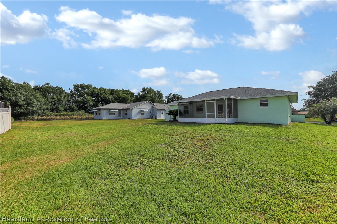4441 Leaf Road Sebring, FL 33875 - Photo 17 of 21 a view of a house with a yard