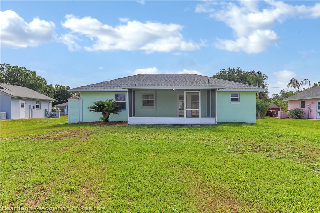 4441 Leaf Road Sebring, FL 33875 - Photo 18 of 21 a front view of a house with a garden