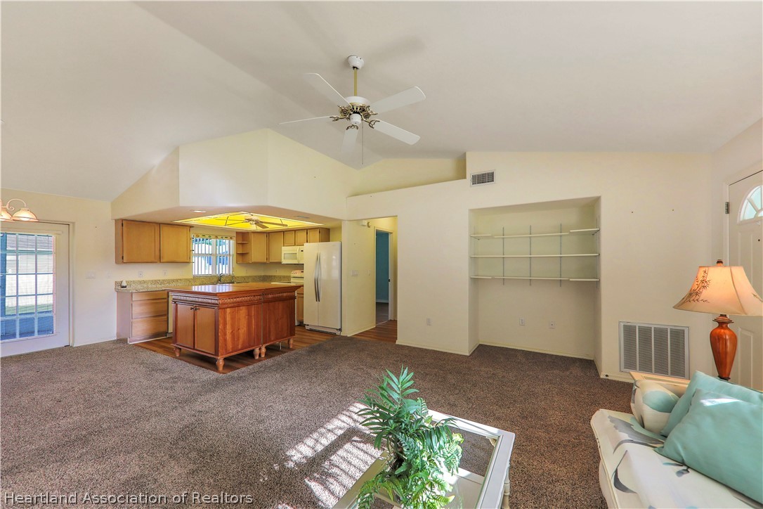 4441 Leaf Road Sebring, FL 33875 - Photo 4 of 21 a spacious bedroom with a bed and a window