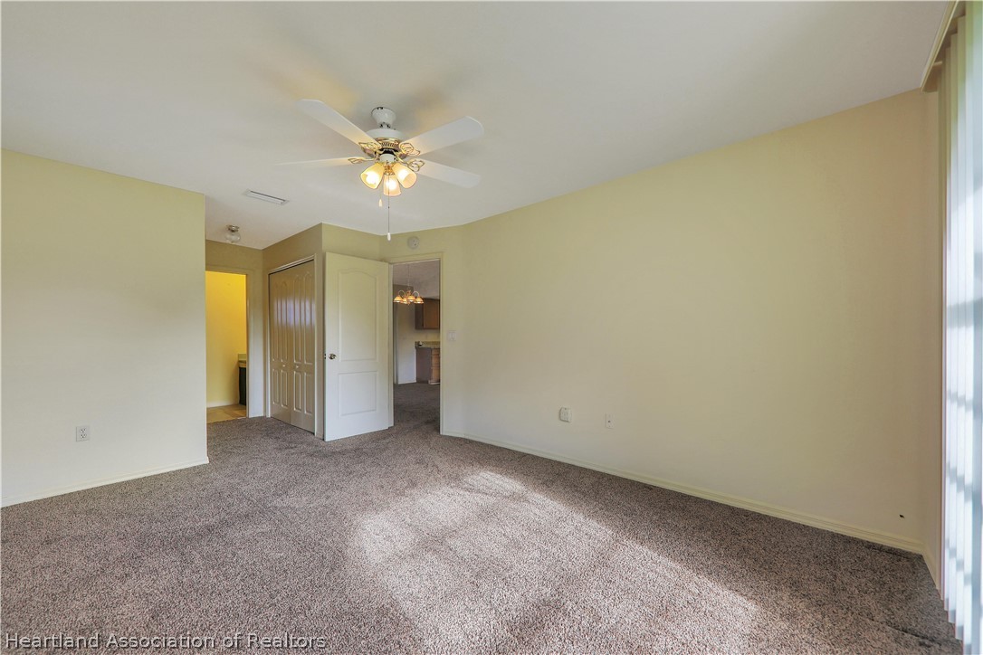 4441 Leaf Road Sebring, FL 33875 - Photo 10 of 21 a view of an empty room and a ceiling fan