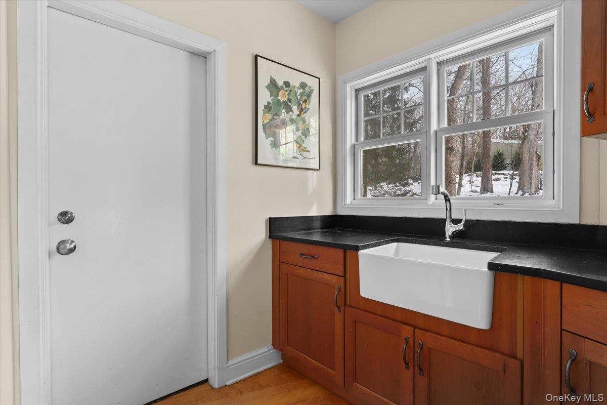 28 Cradle Rock Road Pound Ridge, NY 10576 - Photo 27 of 30 Mudroom with custom cabinetry & sink, closet and door to 2 Car Garage
