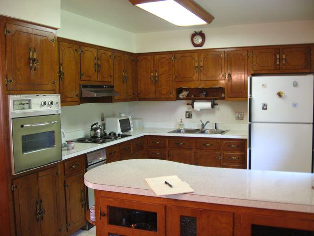 3601 Conner Grove Road Southwest Willis, VA 24380 - Photo 8 of 10 a kitchen with stainless steel appliances a stove a refrigerator a sink and cabinets