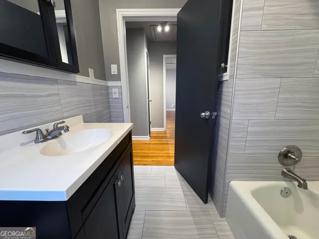 a bathroom with a sink and a bathtub