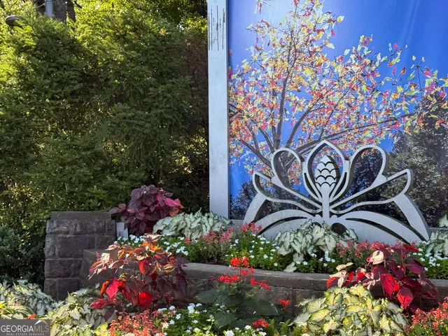 a sign that is in front of flowers