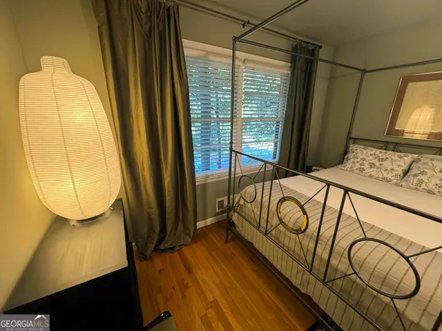 a bed room with a bed and a window