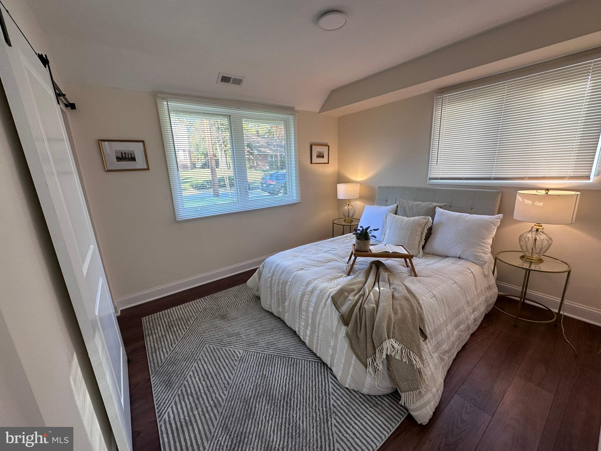 1107 Navahoe Drive Silver Spring, MD 20903 - Photo 12 of 26 a bed sitting in a bedroom next to a window