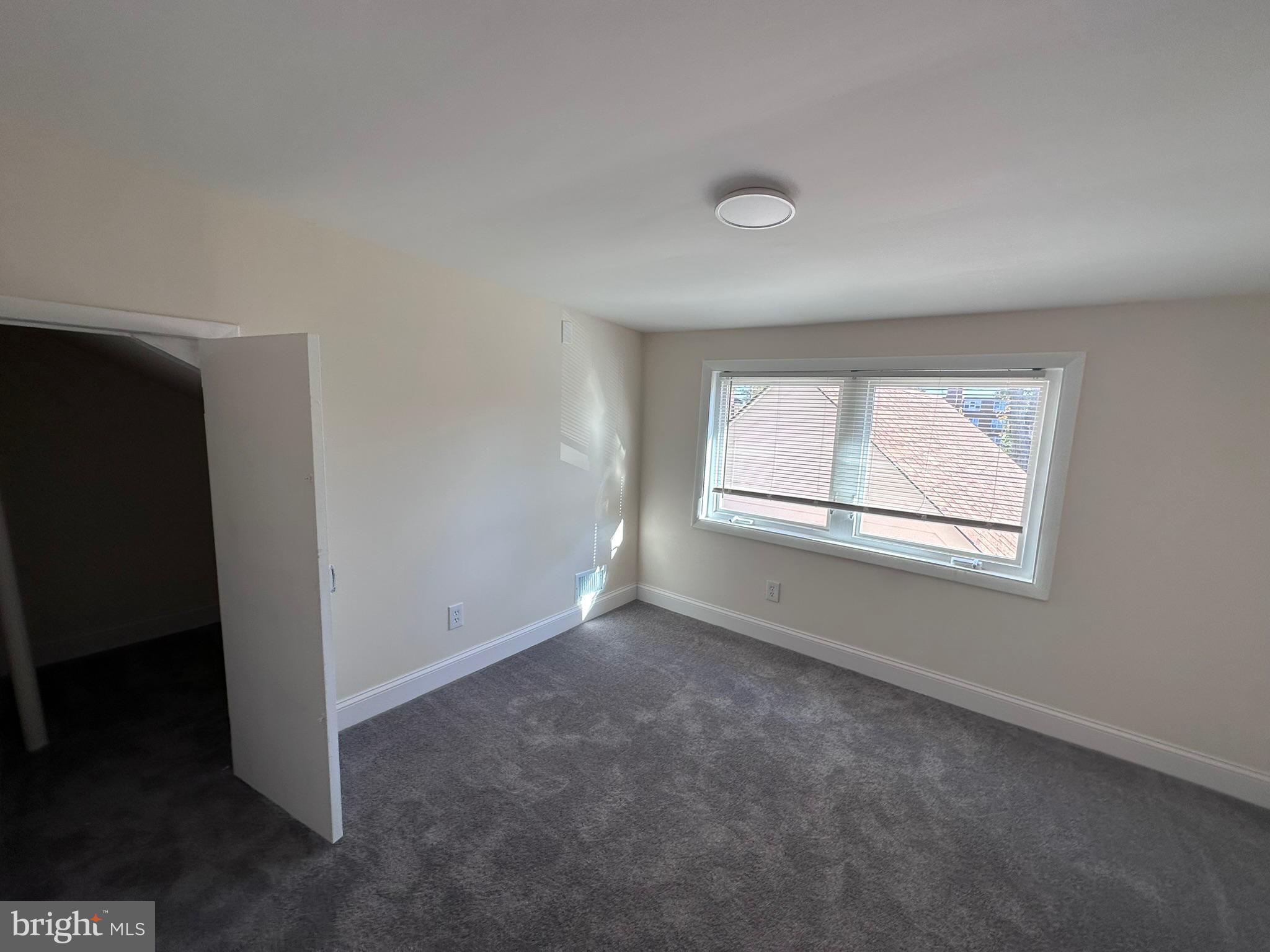 1107 Navahoe Drive Silver Spring, MD 20903 - Photo 17 of 26 an empty room with a window