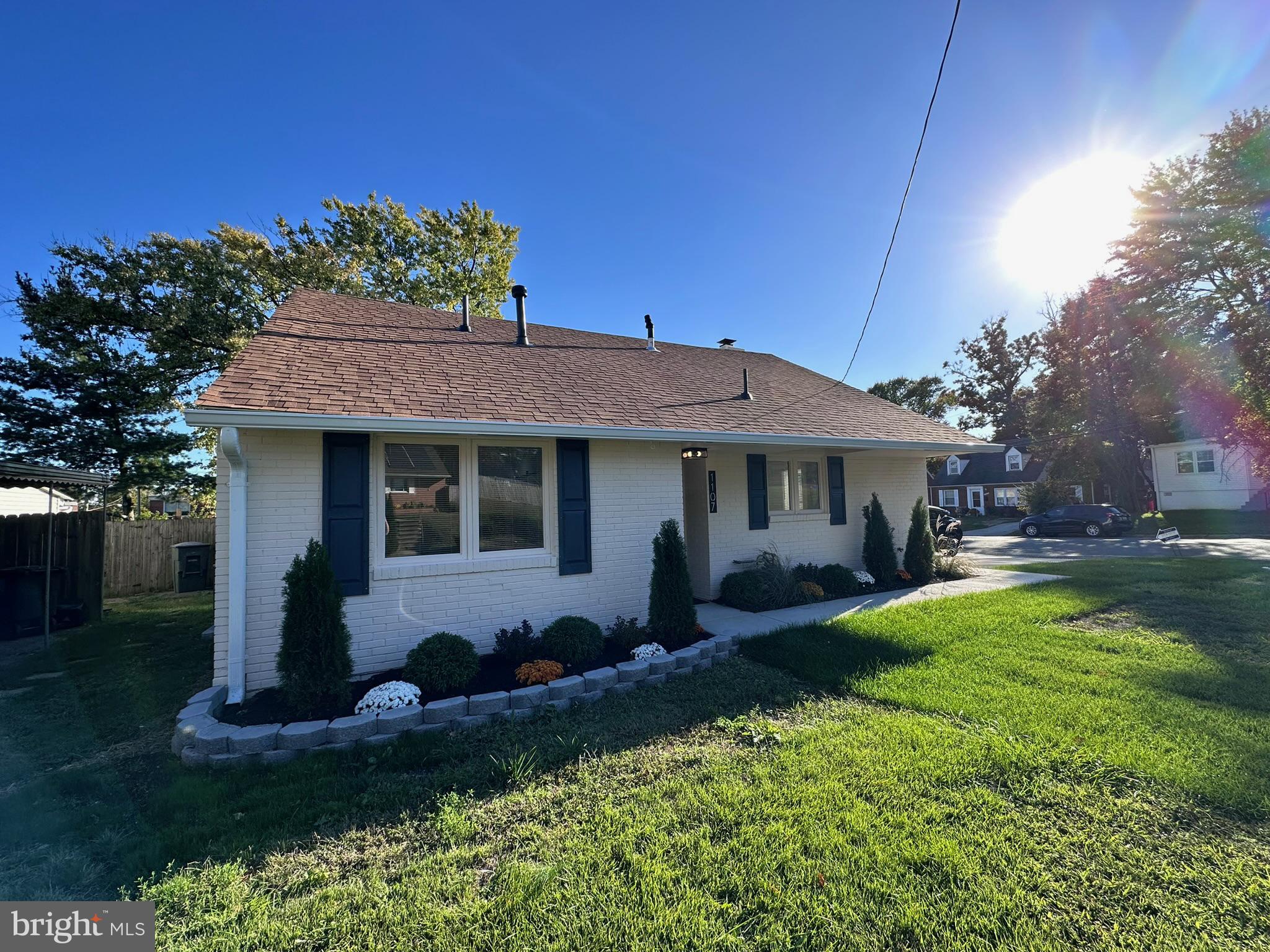 1107 Navahoe Drive Silver Spring, MD 20903 - Photo 2 of 26 a front view of a house with a porch and a yard