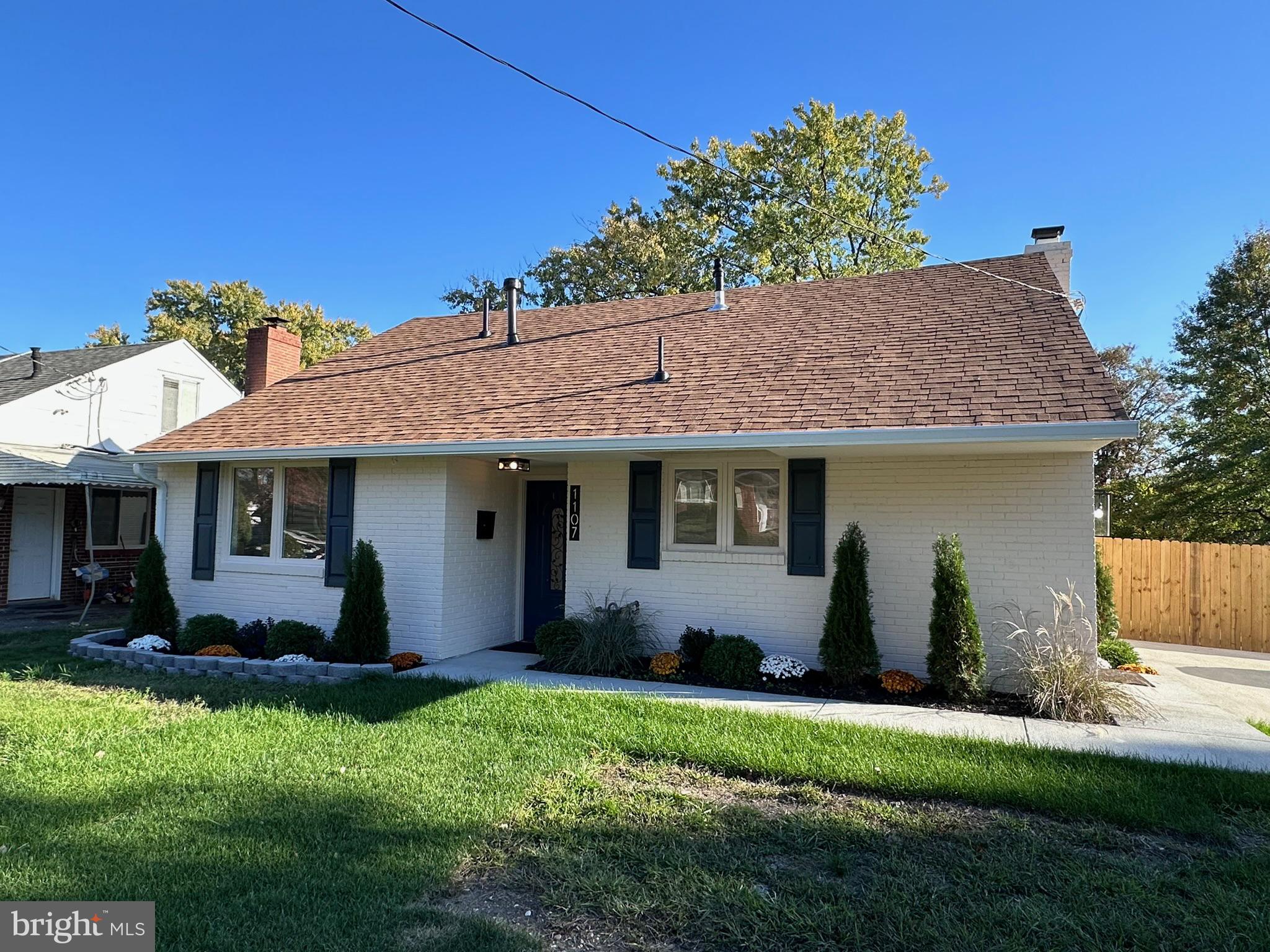 1107 Navahoe Drive Silver Spring, MD 20903 - Photo 25 of 26 a front view of house with a garden