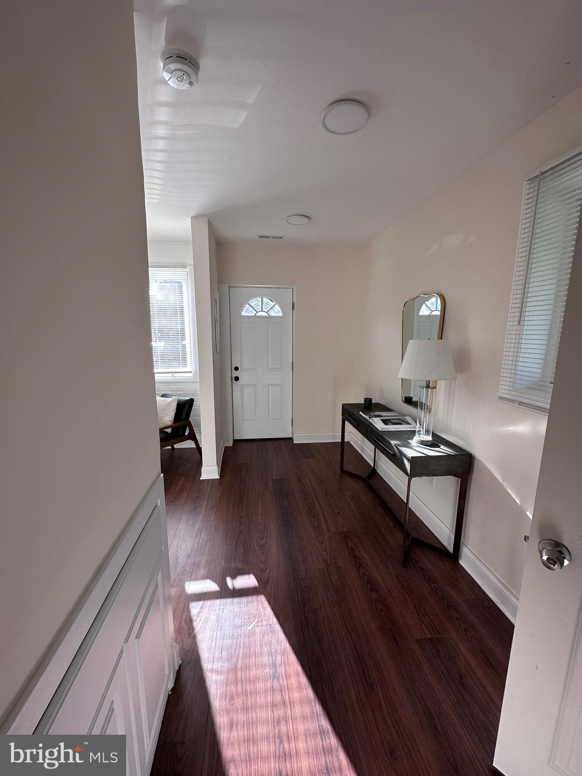 1107 Navahoe Drive Silver Spring, MD 20903 - Photo 3 of 26 a living room with a couch and wooden floor