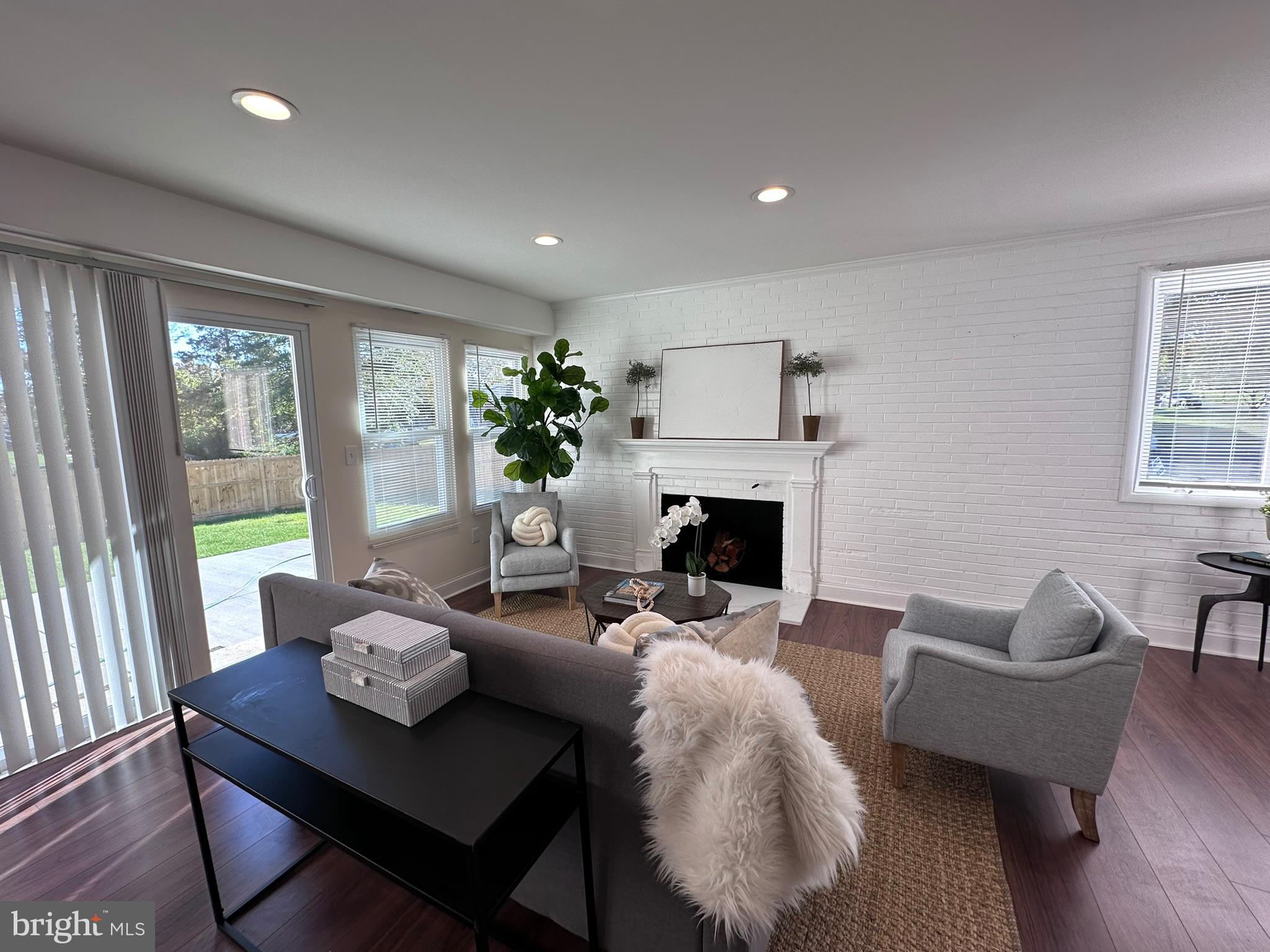 1107 Navahoe Drive Silver Spring, MD 20903 - Photo 5 of 26 a living room with furniture and a fireplace