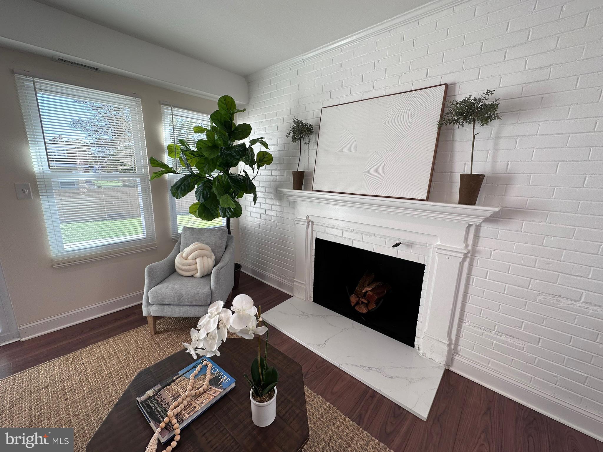 1107 Navahoe Drive Silver Spring, MD 20903 - Photo 8 of 26 a living room with furniture and a fireplace