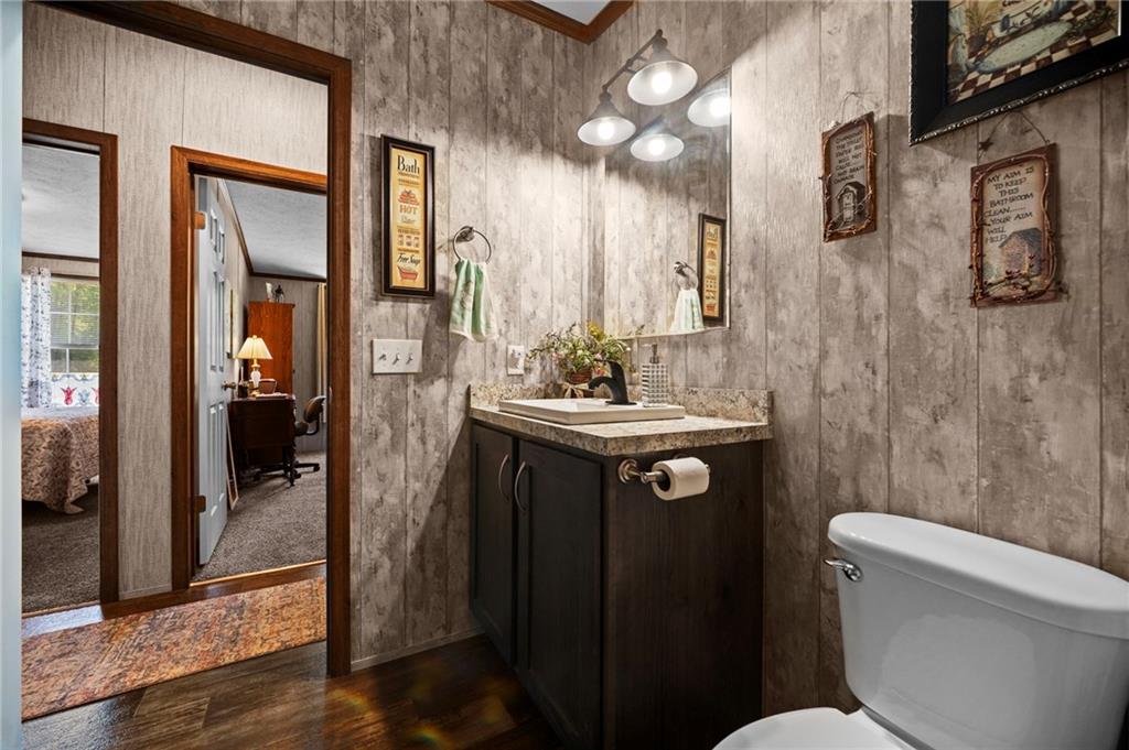 73 South Summit Road, Unit 510 Greenville, PA 16125 - Photo 26 of 33 a bathroom with a toilet a sink a mirror and vanity