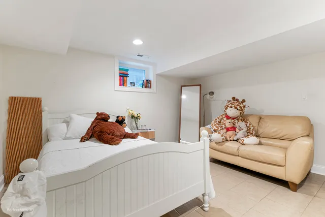 a bed room with a bed and a couch