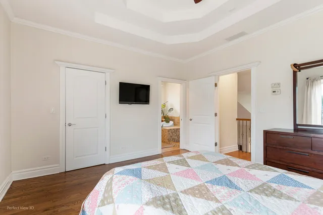 a bedroom with a bed and a dresser