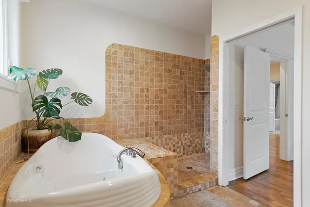 a white bath tub sitting in a bathroom