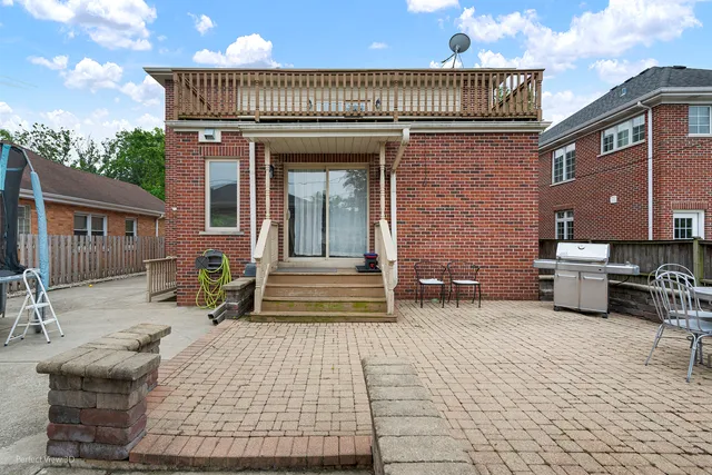 a view of a house with patio outdoor seating area