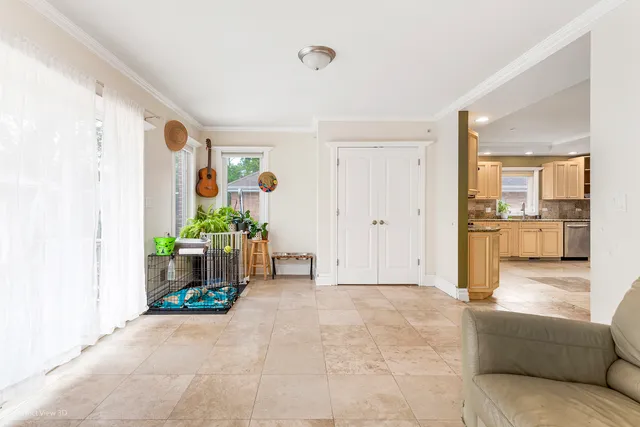 a view of a hallway with wooden cabinet and a living room