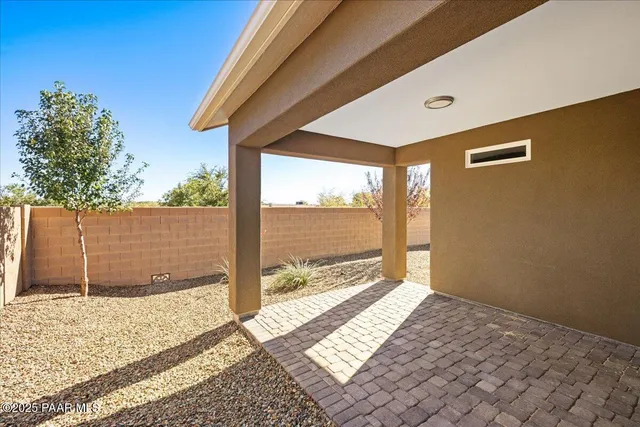 a view of a backyard of a house
