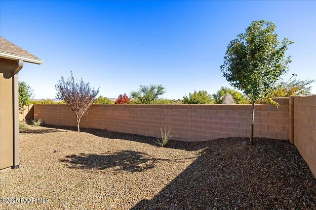 a view of a backyard of the house