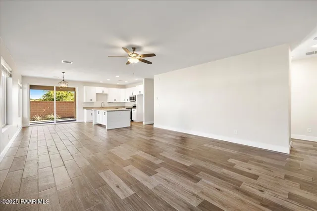 a view of a kitchen with a dishwasher and a stove top oven