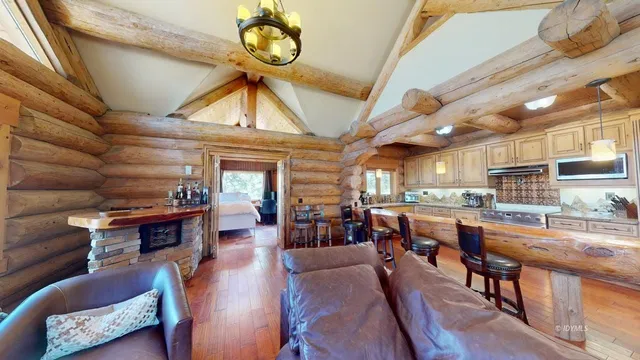 a living room with lots of furniture and a chandelier