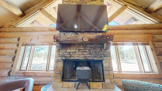 a view of a room with wooden floor and furniture