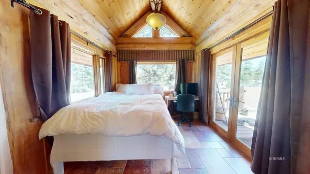 a view of balcony with wooden floor and outdoor seating