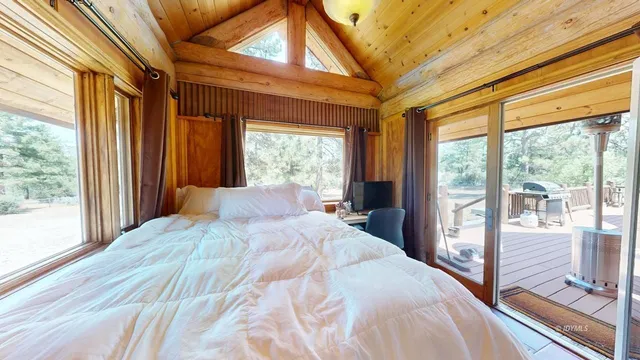a view of balcony with wooden floor and outdoor seating
