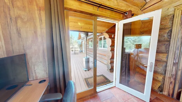 a bathroom with a granite countertop sink and mirror with bathtub