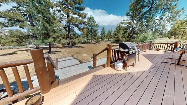 a bathroom with a granite countertop sink a mirror a toilet and shower