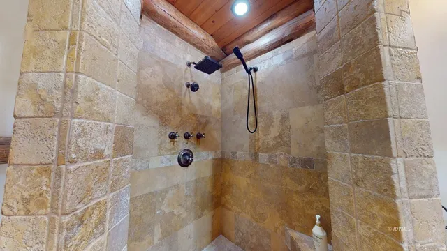 a living room with furniture a ceiling fan and a rug