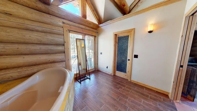 a view of a patio with table and chairs potted plants