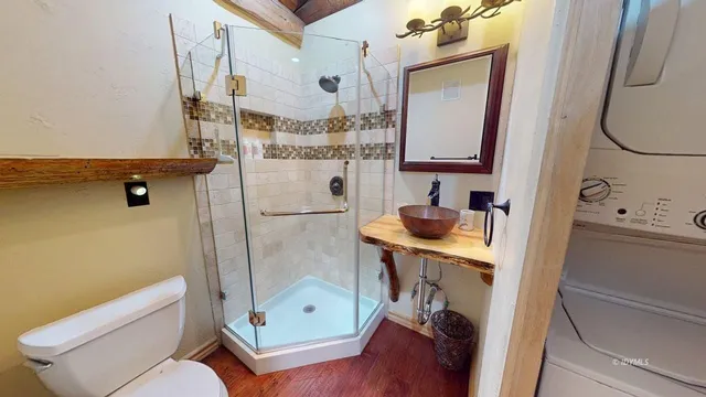 a view of dirt road with a building in the background