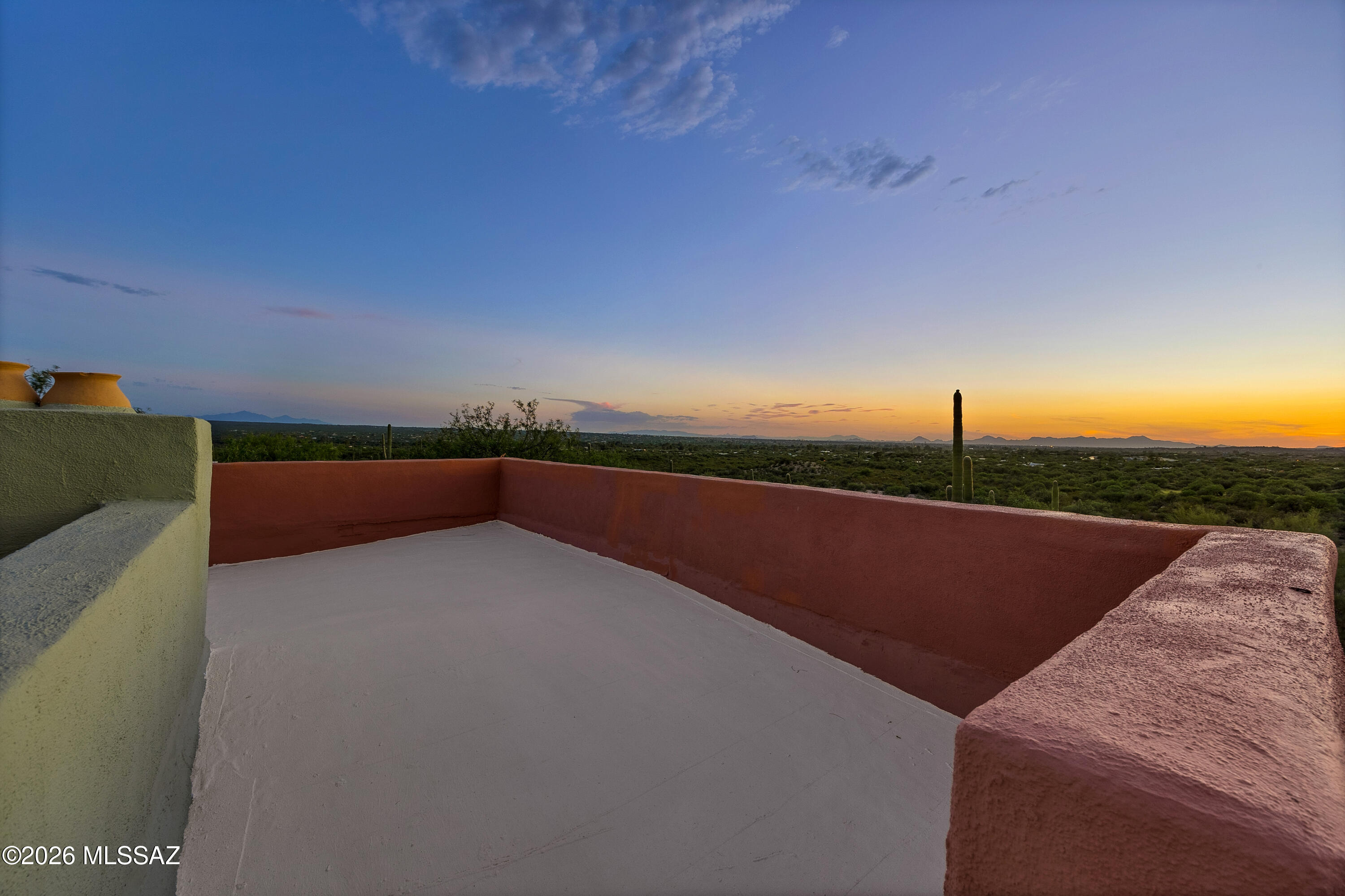 13013 East Redington Road Tucson, AZ 85749 - Photo 43 of 51 A set of stairs leads to the rooftop on the main residence for 360 degree views of the mountains and valley.
