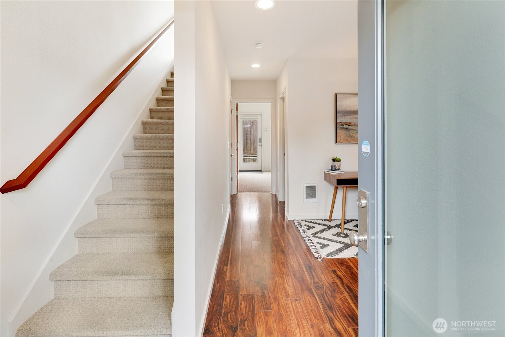 14308 Midvale Avenue North Seattle, WA 98133 - Photo 20 of 29 a view of a hallway with wooden floor and staircase