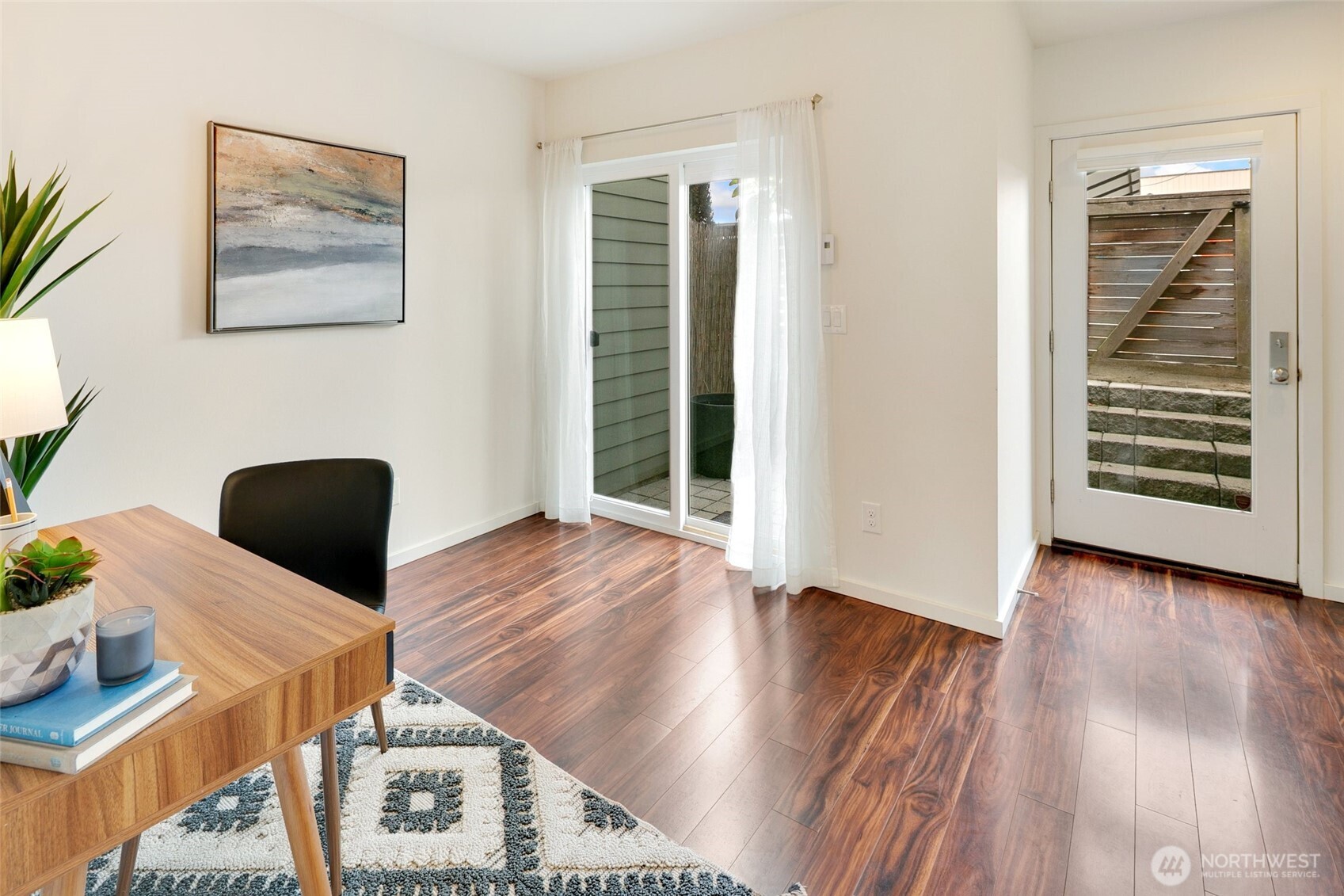 14308 Midvale Avenue North Seattle, WA 98133 - Photo 21 of 29 a view of a hardwood floor and wardrobe