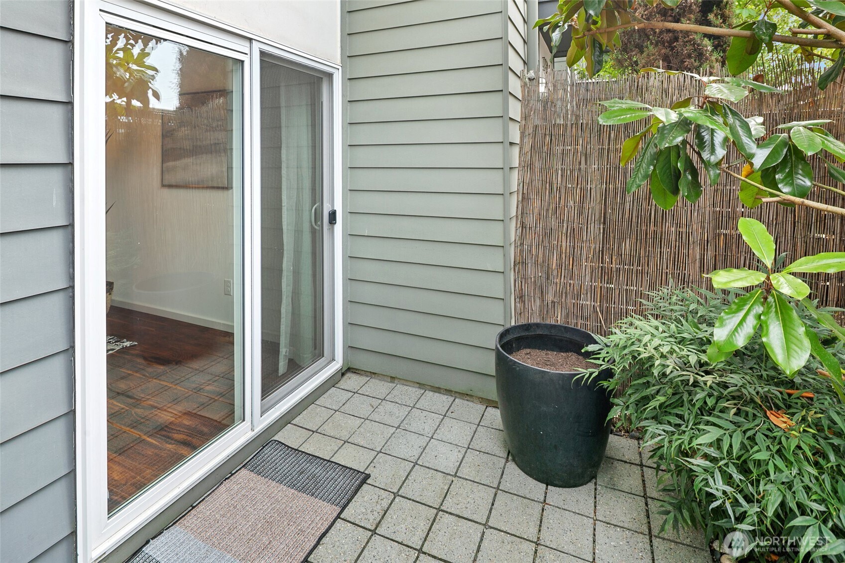 14308 Midvale Avenue North Seattle, WA 98133 - Photo 27 of 29 a view of potted plant in front of a glass door