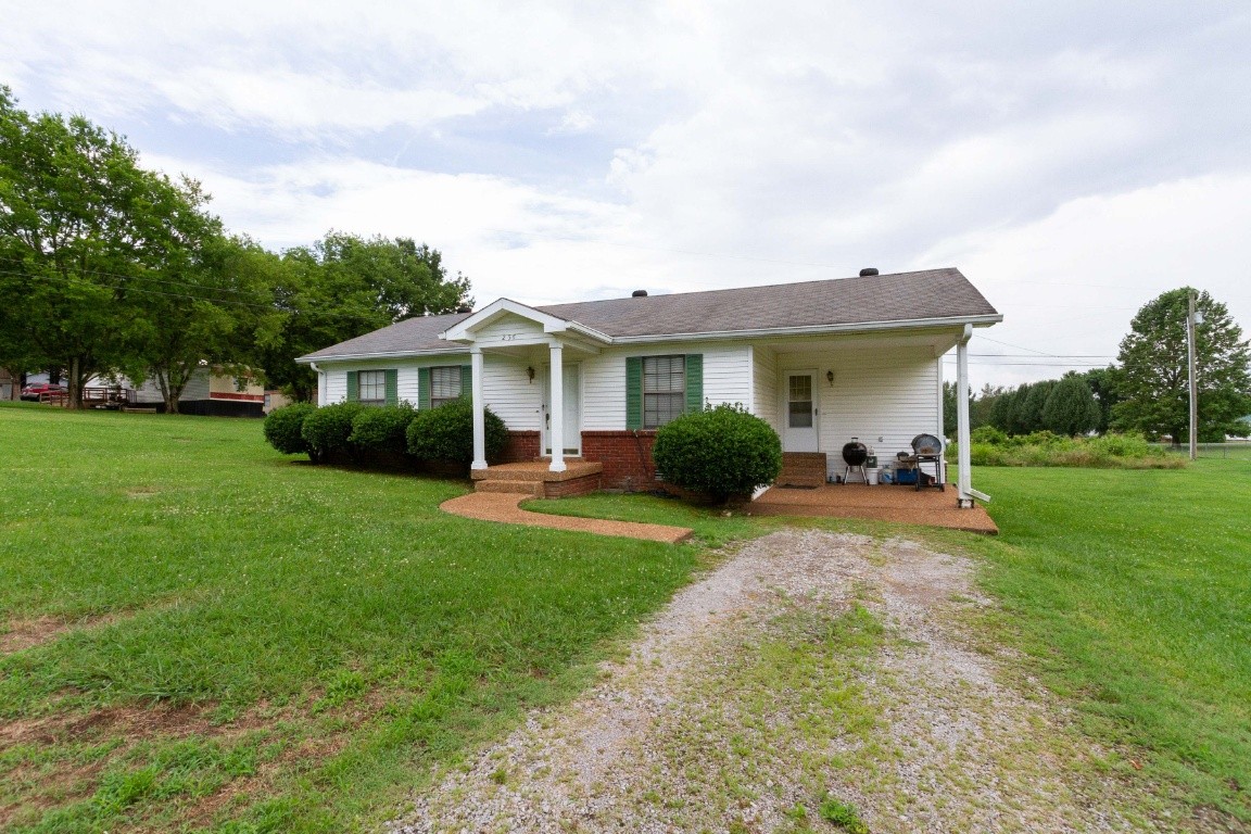 256 Atkinson Road Lebanon, TN 37090 - Photo 2 of 34 a view of a house with backyard sitting area and garden