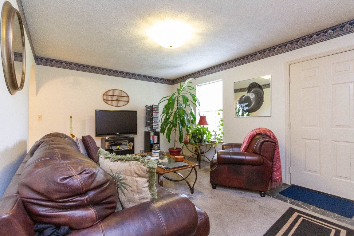 256 Atkinson Road Lebanon, TN 37090 - Photo 15 of 34 a living room with furniture and a flat screen tv