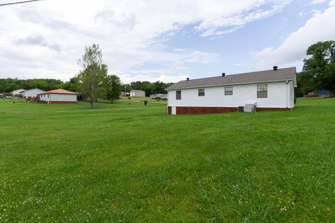256 Atkinson Road Lebanon, TN 37090 - Photo 32 of 34 a view of a house with a big yard and large trees