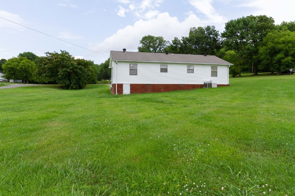 256 Atkinson Road Lebanon, TN 37090 - Photo 33 of 34 a view of a backyard with a garden and entertaining space