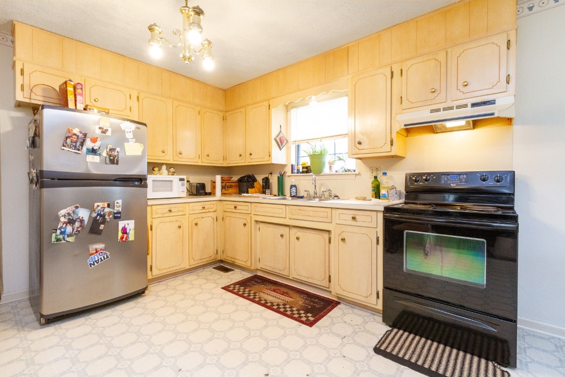 256 Atkinson Road Lebanon, TN 37090 - Photo 7 of 34 a kitchen with a sink cabinets and window
